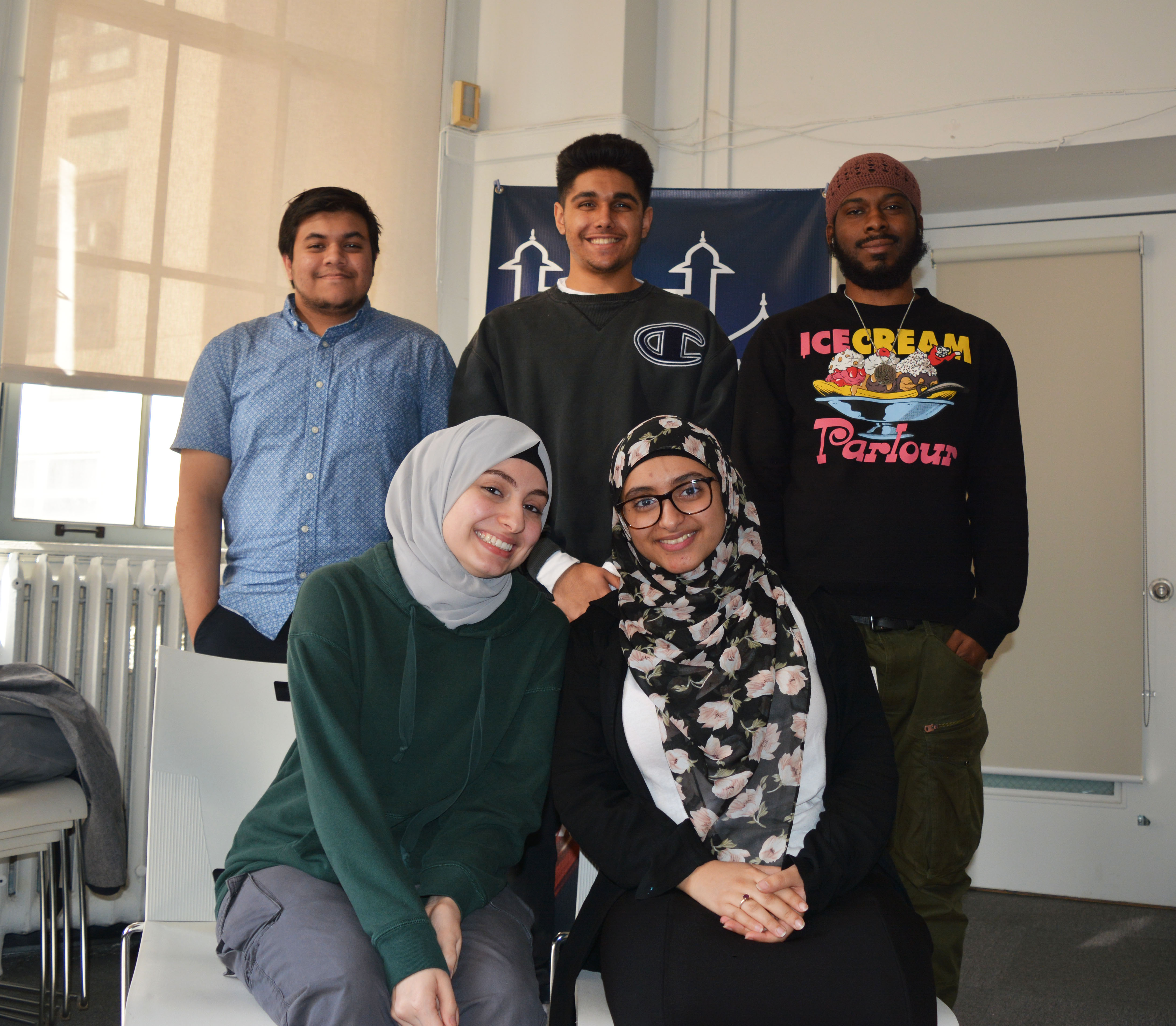 “Every once in a while, we have a Dawaat dinner and we invite all our friends at Multi Faith center and at Hunter to break breads with us or at least wind up and have some conversations about our faith or life in general,” said. Sphomore Anjum Biswas, standing on (left) with his friends Hussain Arif, Ayuub Cumberbatch, Ayah Ahmad, Kaitlyn at the Multi Faith Center.