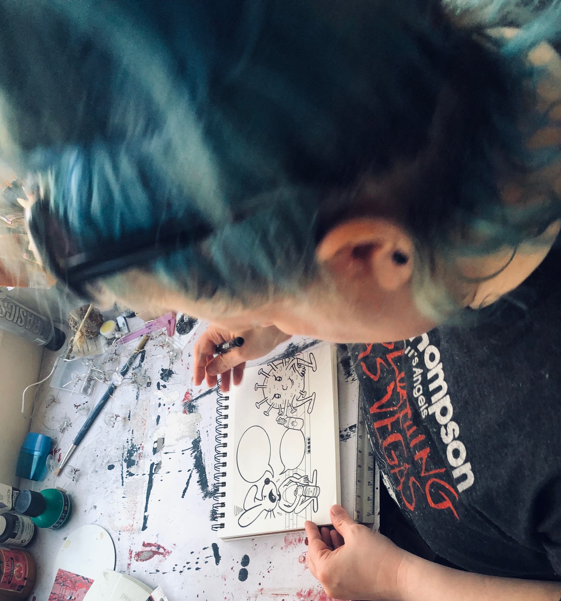 Photo credit Ben HermanMichele Borg, a studio art major and a comic book creator, enjoys her time off because she is able to focus on her artwork. HereBorg drew one of her characters, Psycho Bunny, conversing with a coronavirus. “Psycho Bunny will say ‘Get the F**** out of here’,” said Borg
